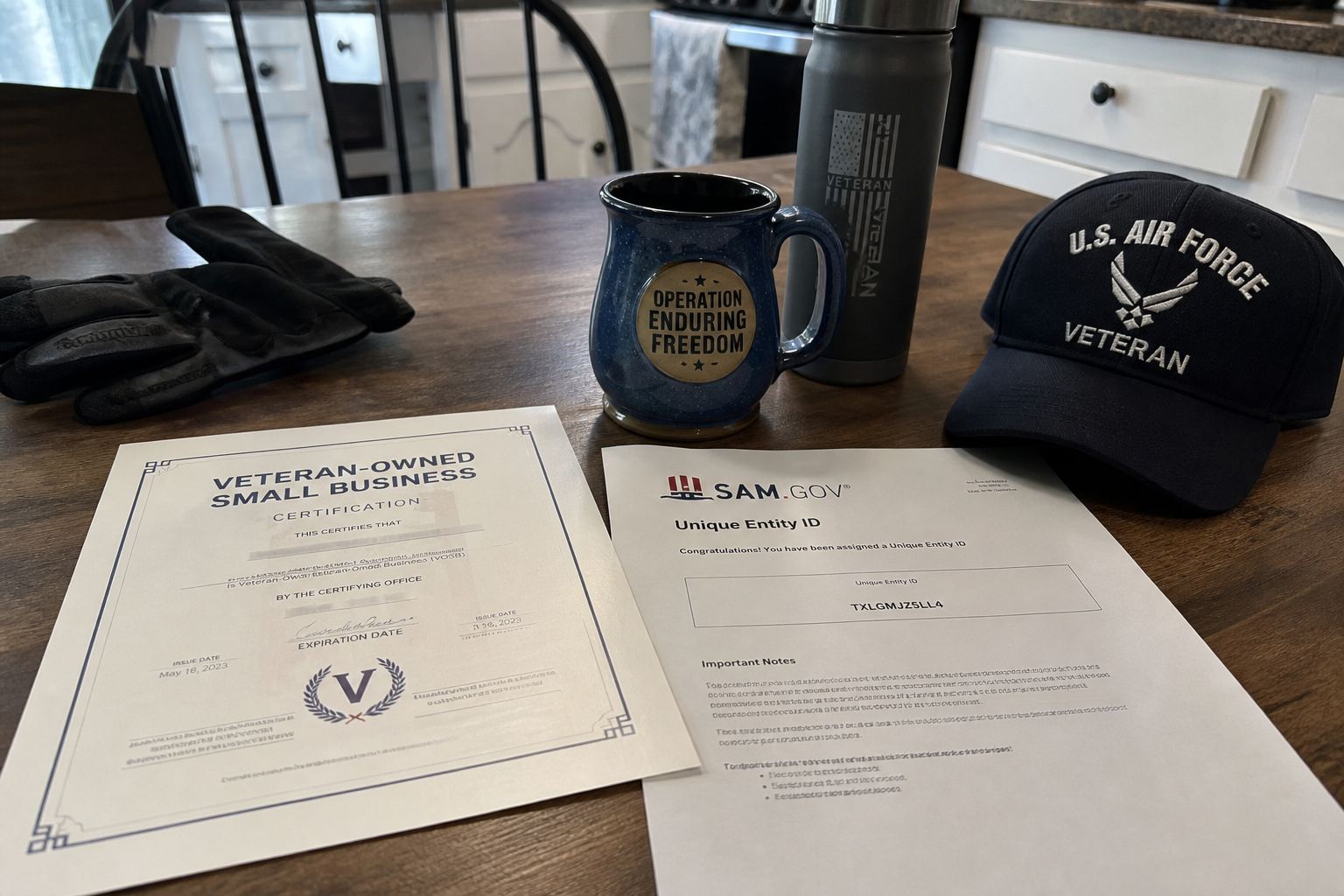 A veteran-owned certification printout next to a Unique Entity ID confirmation.